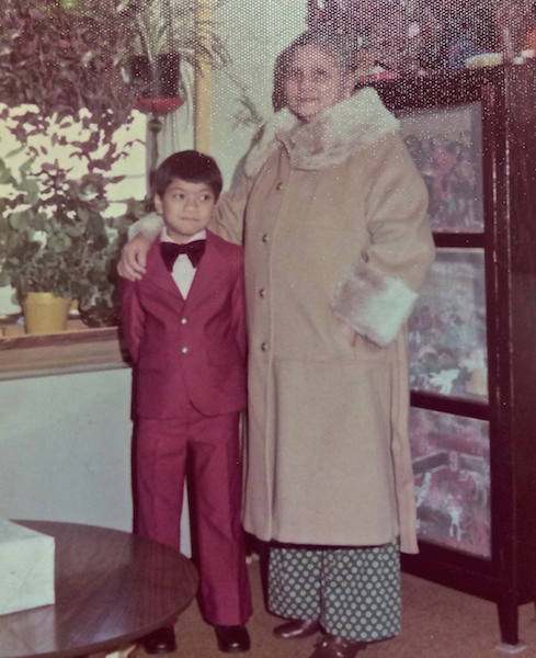 Andrew Tolentino standing dapper next to his Grandma.