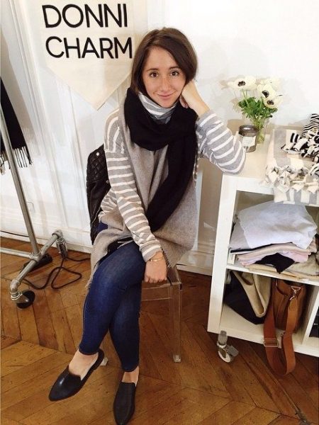 Alyssa Wasko, Donni Charm founder and happy MakeSpace NYC storage customer, is sitting in a chair and smiling