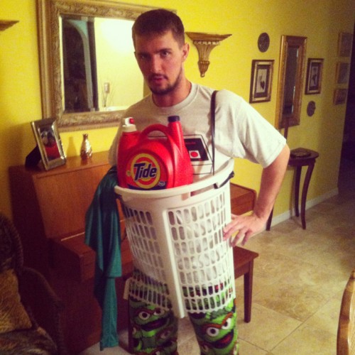A man wearing a laundry basket DIY Halloween costume.