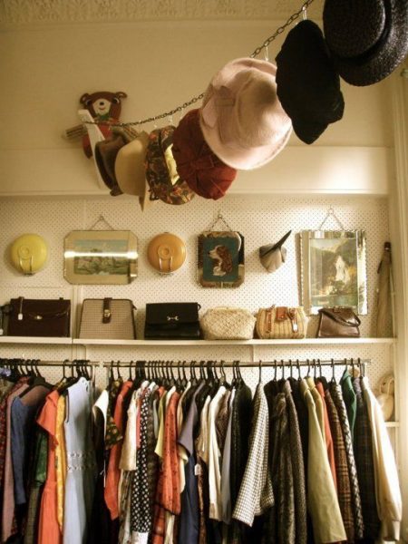 diy hat hanger made from a chain and safety pins
