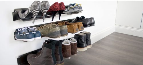 shoes, boots, sneakers, and heels stored on wall-mounted shoe racks