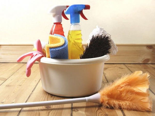 some cleaning supplies gathered in a bucket