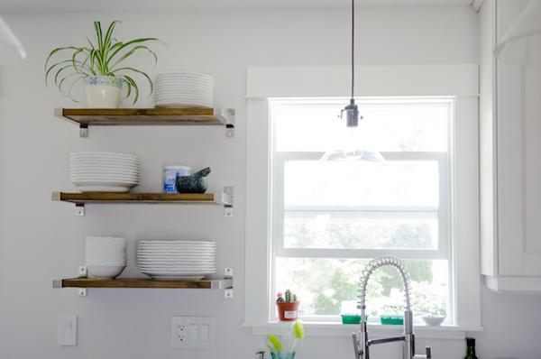 wooden floating shelves in a kitchen
