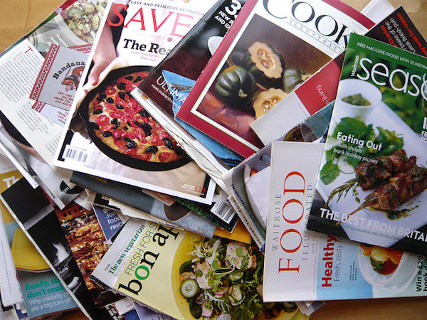 A sizable pile of old magazines like Food and Bon apetit