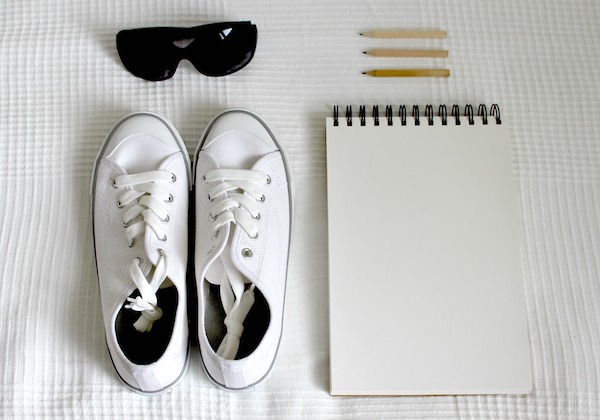 just the essentials shoes notebook sunglasses pencils