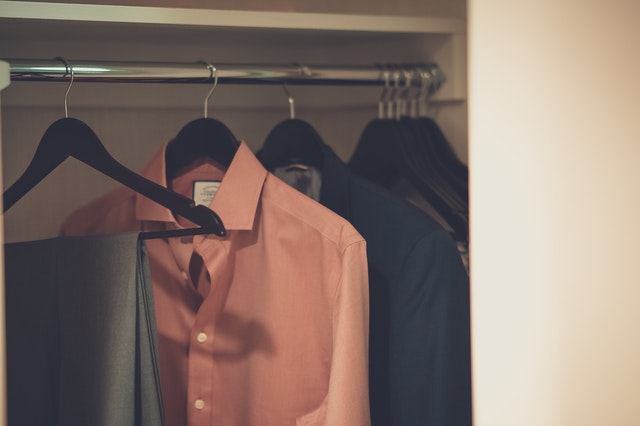 clothes hanging in the closet